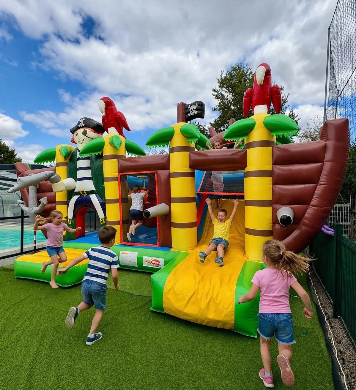 Children on the campground's bouncy castle